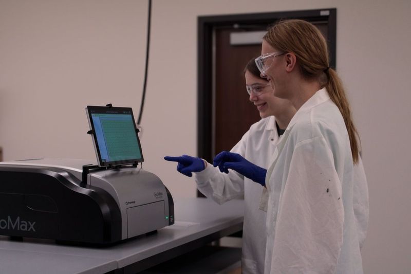 Tessara Clark and Evelyn Zadzilka work in the lab during their Maydm high school internships in Promega R&D